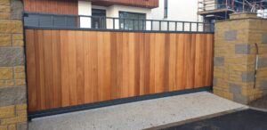 Tall Metal Framed Timber Sliding Gates with Square Feature