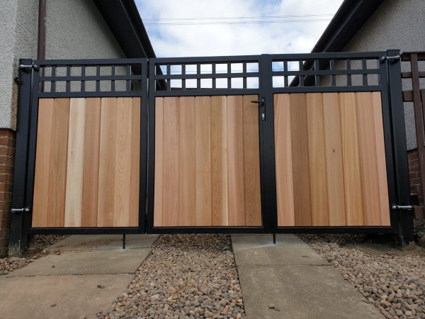 Metal Framed Timber Bi Fold Gates with Central Swing Door with Dual Square Feature