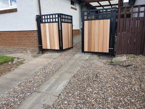 Metal Framed Timber Bi Fold Gates with Central Swing Door with Dual Square Feature