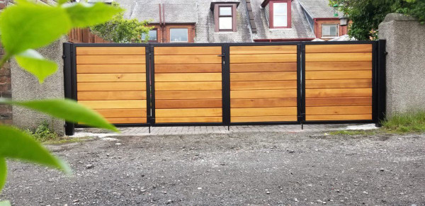 Tall Metal Framed Timber Bi Fold Driveway Gates