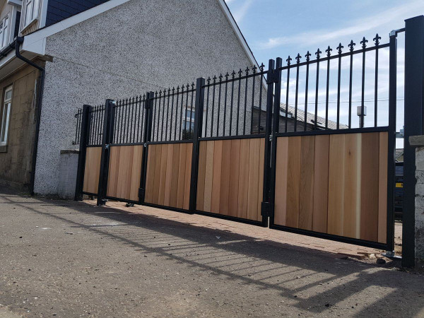 Tall Metal Framed Half Timber Bi Fold Gates with Railheads
